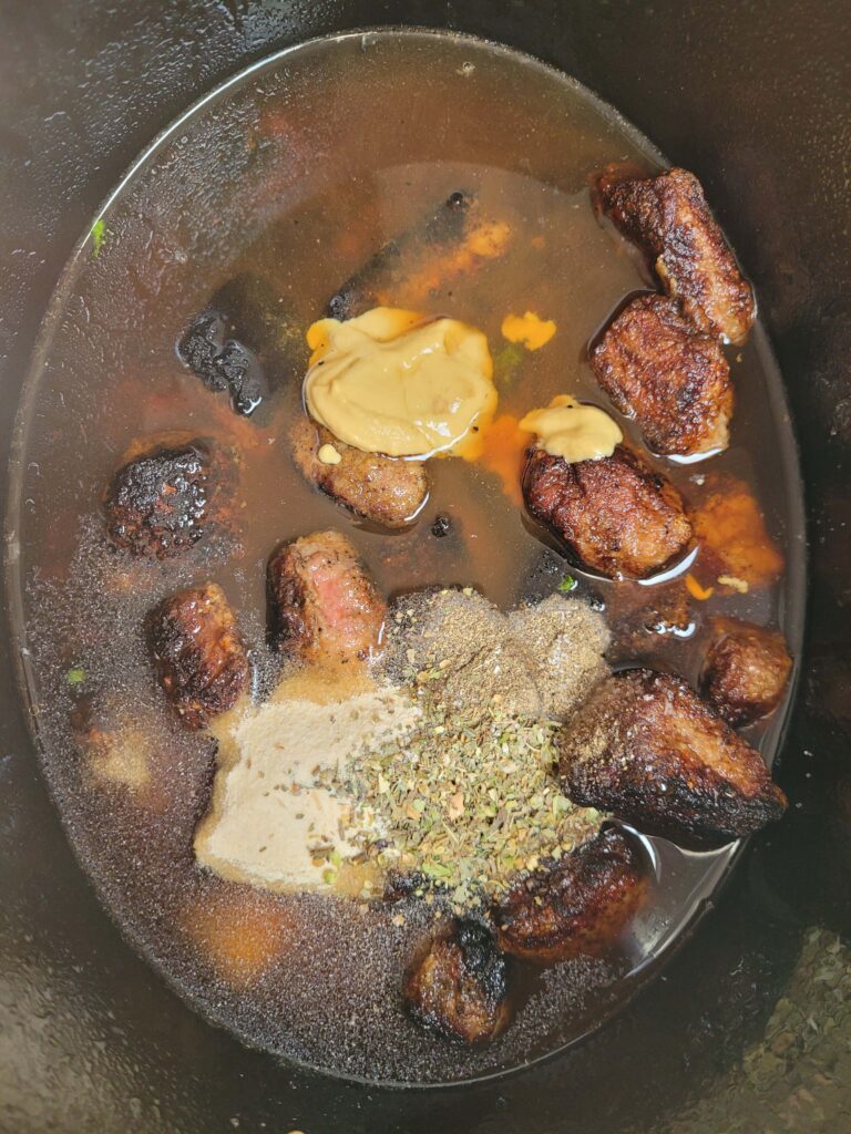 ADDING SEASONINGS TO SLOW COOKER