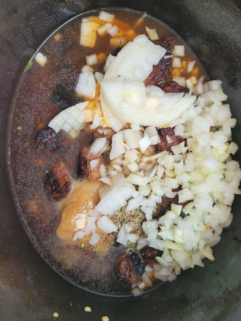 ADDING ONION AND GARLIC TO STEW MEAT