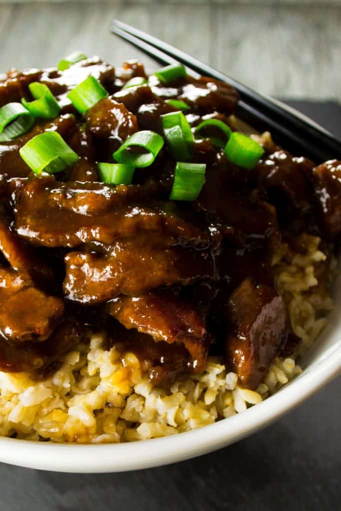 P.F. Chang Style Mongolian Beef | This sweet and spicy P.F. Chang's Mongolian Beef dish is rich with Asian inspired flavors and tastier than any Chinese take out you could have delivered. | Pack Momma | https://www.awickedwhisk.com