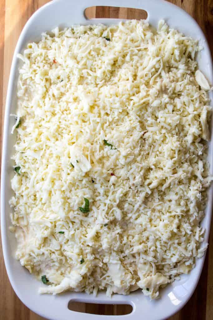 White Chicken Lasagna covered in shredded cheese