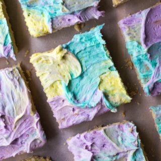 Frostedย Sugar Cookie Barsย are soft, chewy and the easist cream cheese sugar cookies you will ever make.. and let's not forget the multi colored frosting!