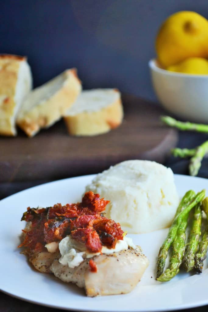 Chicken Bryan Carrabba's Copycat | Chicken Bryan Carrabba's Copycat recipe is juicy chicken with a rich lemon butter sauce, sun-dried tomatoes, creamy goat cheese and fresh basil. Perfect! | Pack Momma | https://www.awickedwhisk.com
