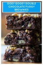 This Best Fudge Brownie Recipe are the most AMAZING chewy fudgy chocolate brownie squares of sinful chocolate brownie goodness you will ever make! Made quick and easy, this Best Fudge Brownie Recipe has a super fudgy middle and is ooey, chewy and gooey with chunks of melted chocolate running through out them. Perfect! | A Wicked Whisk | https://www.awickedwhisk.com #fudgybrownies #easybrownies #chewybrownies #homemadebrownies #doublechocolatebrownies #gooeybrownies #walnutbrownies