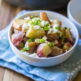 Skillet Red Potatoes with Bacon and Feta in a white bowl