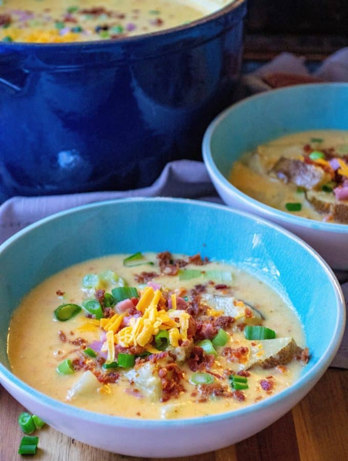 Potato Beer Cheese Soup is beer cheese soup made better with chunks of ham, bacon and potatoes.  Hearty and the perfect bowl of comfort food, this creamy Potato Beer Cheese Soup is ready to eat in just 30 minutes! | A Wicked Whisk