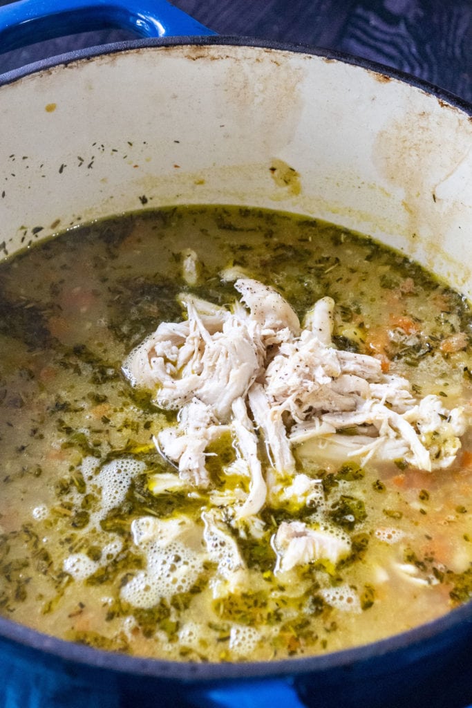 adding chicken to chicken noodle soup