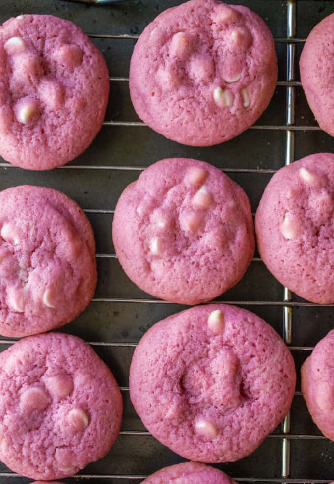 pink cookies on a baking sheet