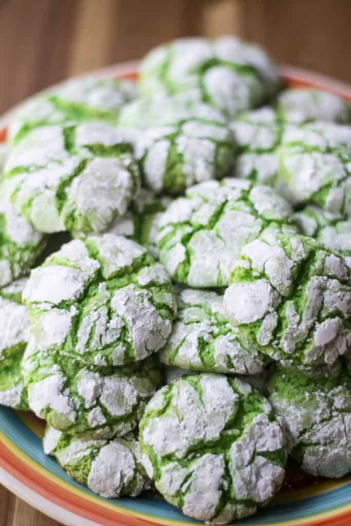 Green Christmas Crinkle Cookies piled up on a plate