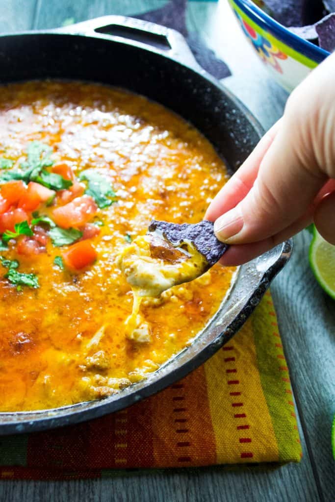 Mexican Queso Fundido | Celebrate Cinco de Mayo (or ANY day) with this Mexican Queso Fundido  .. it's an easy to make oooey, gooey cheesy dip that is a crowd pleaser from the word GO! | Pack Momma | https://www.awickedwhisk.com