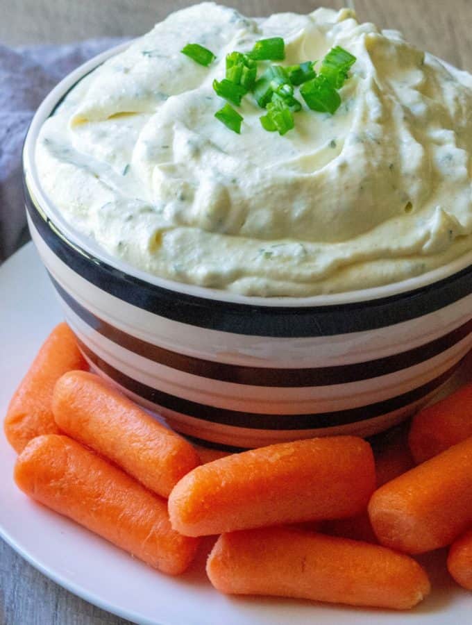 Homemade Ranch Veggie Dip is tangy, packed with tons flavor and the easiest veggie dip to make from scratch in just 5 minutes. Loaded with herbs, spices and a few ingredients you probably already have on hand, this Homemade Ranch Veggie Dip is perfect for snacking on fresh vegetables, dipping your favorite chicken wings or dunkin' your french fries! | A Wicked Whisk