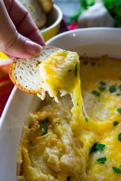 Parmesan Garlic Dip | Parmesan Garlic Dip is the ultimate cheesy, bubbly, hot dip and is the perfect tailgating food! Everyone will be happy, even if their team is losing! | Pack Momma | https://www.awickedwhisk.com