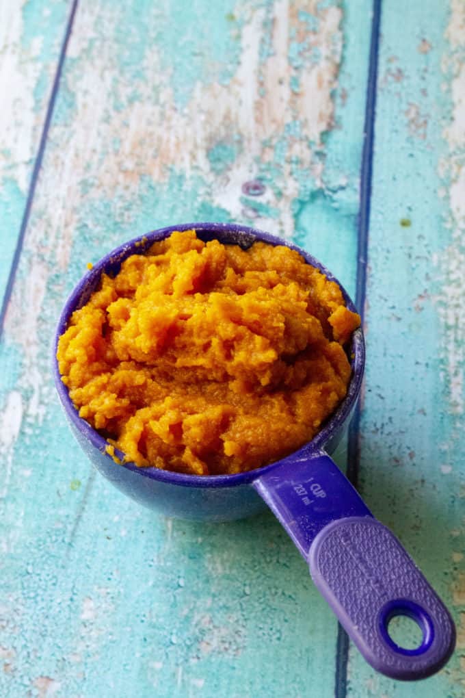 pumpkin puree in a measuring cup for cupcakes