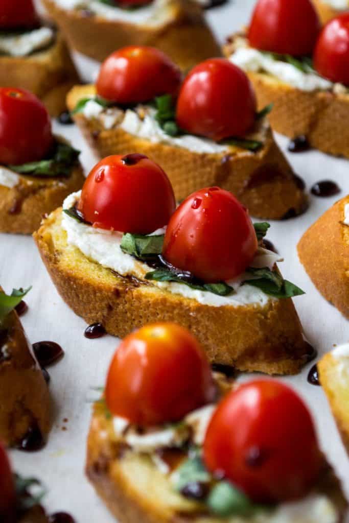 Goat Cheese Bruschetta | Goat Cheese Bruschetta is the perfect appetizer to serve at every party. Toasted bread topped with goat cheese, basil, tomatoes and balsamic glaze. Perfect! | Pack Momma | https://www.awickedwhisk.com