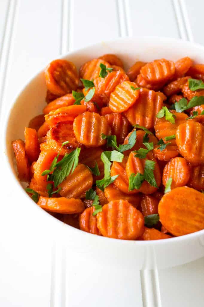 Spicy Honey Glazed Carrots | Spicy Honey Glazed Carrots are sweet with just a hint of spicy and they make the perfect accompaniment to any meal. Talk about the perfect side dish! | Pack Momma | https://www.awickedwhisk.com