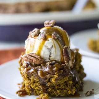 Pumpkin Cobbler with Bourbon Salted Caramel Sauce | Pumpkin Cobbler with Bourbon Salted Caramel Sauce is the perfect fall inspired dessert. Soft, warm and pumpkin spiced with all the fall flavors you crave. | Pack Momma | https://www.awickedwhisk.com