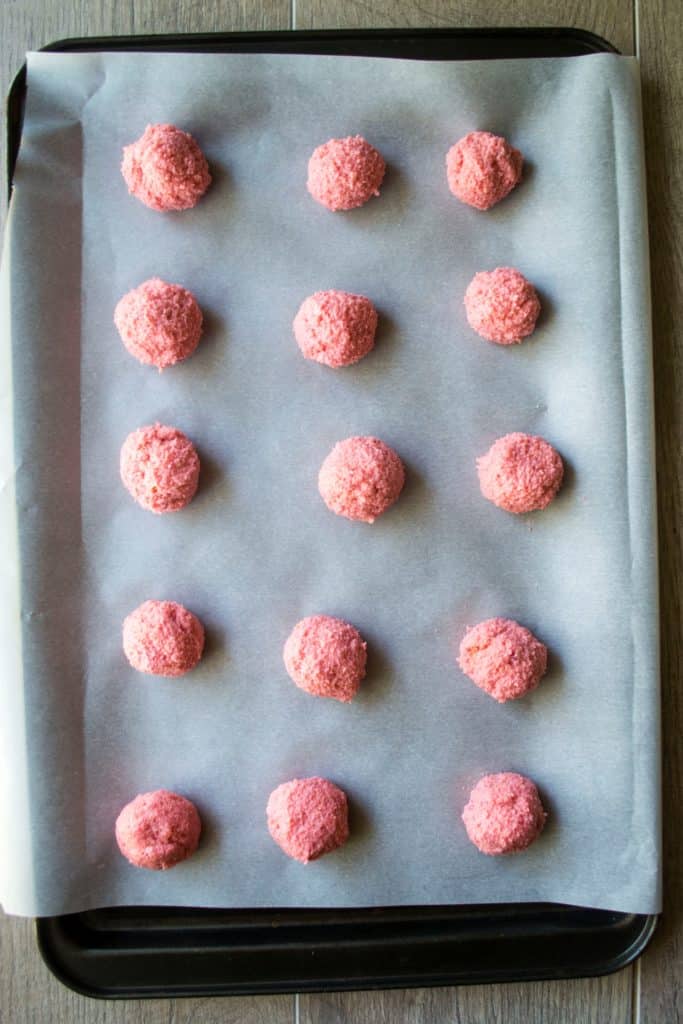 Champagne Cake Pops rolled into balls and set on a baking sheet
