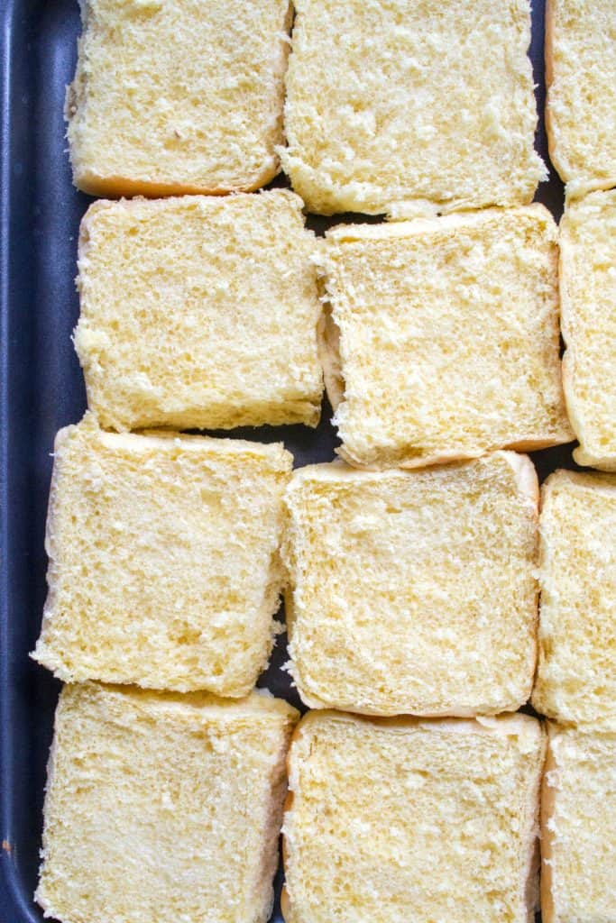 Philly Cheesesteak Sloppy Joe Sliders rolls on a pan