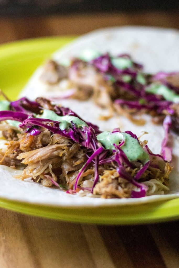 Tangy Red Cabbage Slaw Recipe on a pork taco