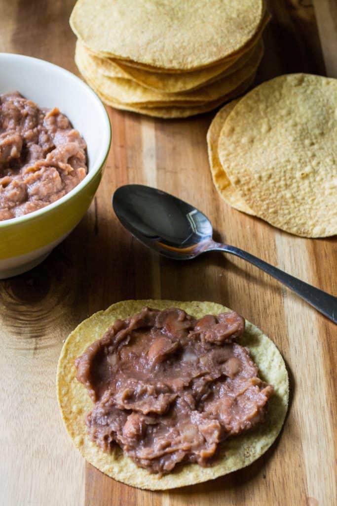 Chicken Tinga Tostadas refried beans