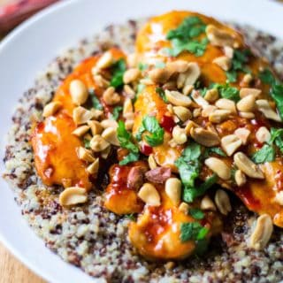 Spicy Thai Chicken with Coconut Lime Quinoa is tender, moist chicken simmered in a spicy Thai sauce and paired with creamy coconut lime quinoa. Sweet, spicy and sticky, this Spicy Thai Chicken with Coconut Lime Quinoa is sure to be your new favorite 30 minute meal!