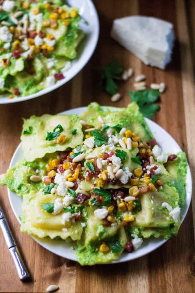 Chicken Ravioli with Jalapeno Pesto is an easy pasta dinner recipe and guarenteed to be you new favorite 30 minute meal. Tender chicken ravioli pasta topped with the bold flavors of garlic jalapeno pesto, this quick dinner recipe is perfect comfort food.
