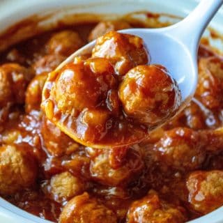 Slow Cooker Spicy Hawaiian Meatballs are tangy, easy and made with only FOUR ingredients!! Fast to throw together and super tasty, these Slow Cooker Spicy Hawaiian Meatballs are the best slow cooker party meatballs to feed a hungry crowd.