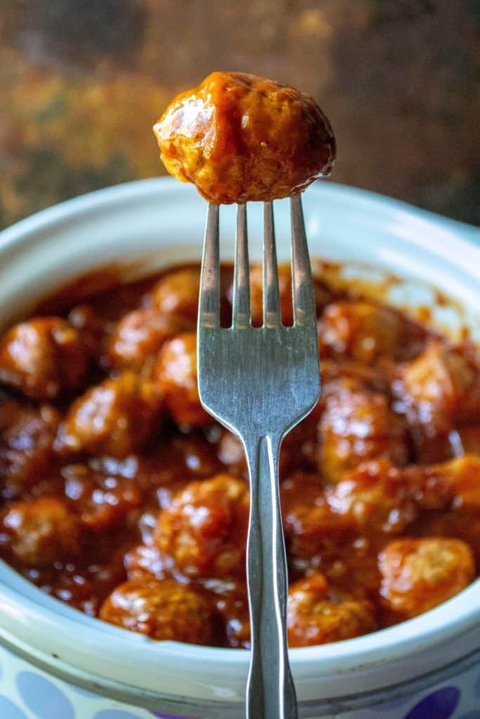 Slow Cooker Spicy Hawaiian Meatballs on a fork