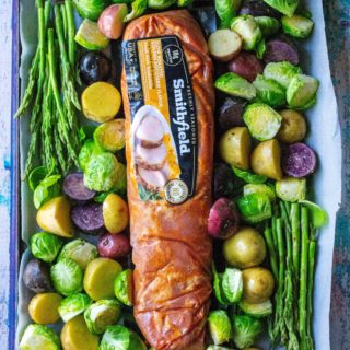 This Easy Sheet Pan Pork Tenderloin Dinner is the perfect healthy and delicious family friendly meal with easy prep and super fast clean up.  Using super flavorful marinated Smithfield Golden Rotisserie pork tenderloin, this easy sheet pan dinner does all the work for you!