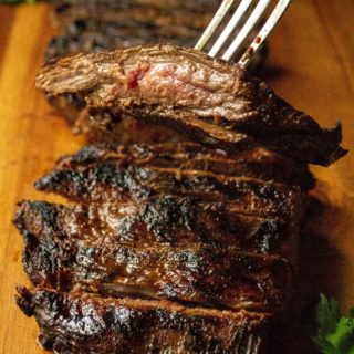 Soy Marinated Broiled Flank Steak is a tender broiled flank steak perfectly seasoned by an overnight flank steak soy sauce marinade. Easily cooked in your oven, this Soy Marinated Broiled Flank Steak is tender on the inside and perfectly seared on the outside.