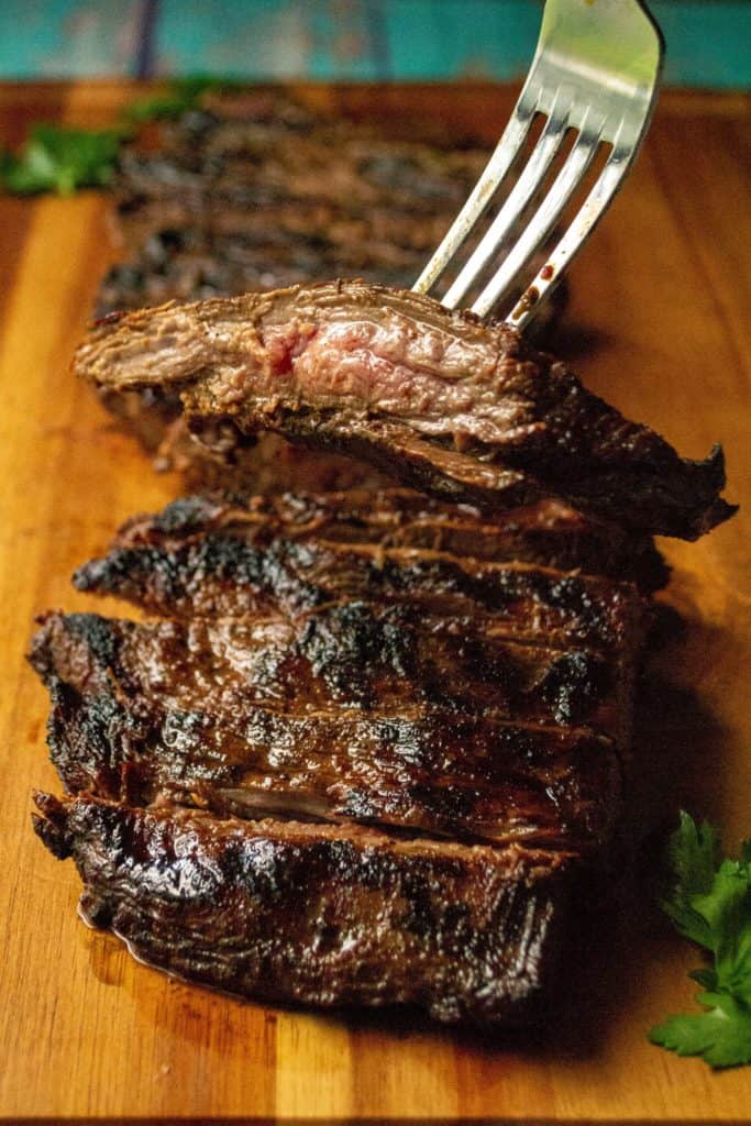 Soy Marinated Broiled Flank Steak is a tender broiled flank steak perfectly seasoned by an overnight flank steak soy sauce marinade. Easily cooked in your oven, this Soy Marinated Broiled Flank Steak is tender on the inside and perfectly seared on the outside.