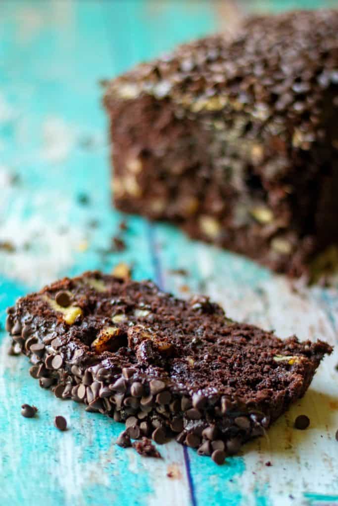 Triple Chocolate Banana Bread is super moist banana bread with TRIPLE chocolate throughout. Super easy chocolate banana bread speckled with mini chocolate chips and then slathered in homemade chocolate buttercream frosting makes this Triple Chocolate Banana Bread a chocolate lovers dream! | A Wicked Whisk