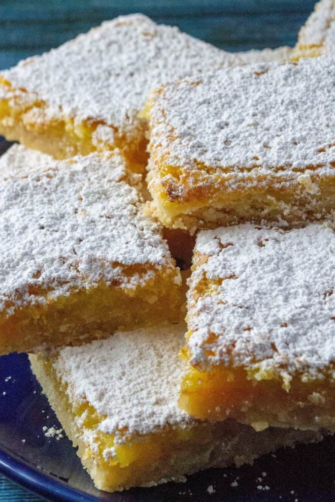 Easy Classic Lemon Bars stacked on a plate