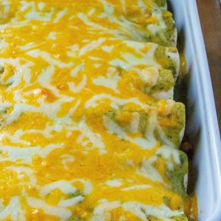 Breakfast Enchiladas with Poblano Sauce are hearty, spicy and perfect for feeding a crowd.  Made with eggs, bacon, sausauge crumbles and spicy potatoes, these Breakfast Enchiladas are the tastiest way to start the day. | A Wicked Whisk