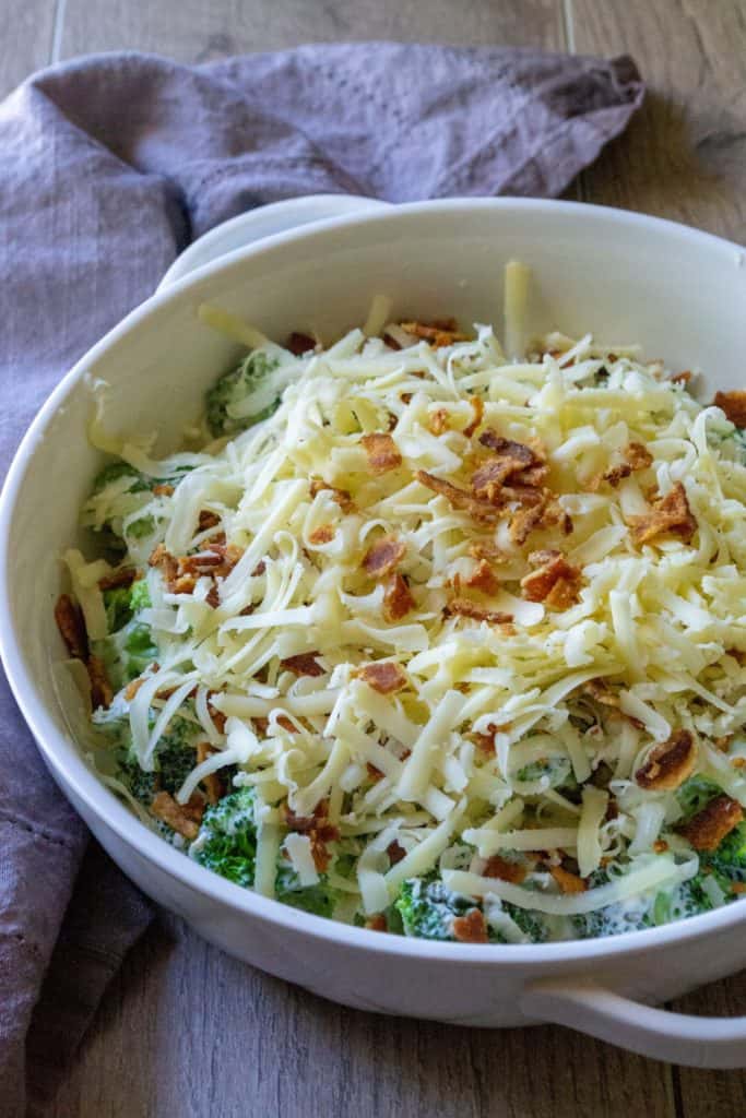 Cheesy Bacon Broccoli Casserole covered in cheese