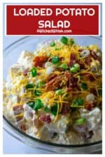 Loaded Potato Salad is tender, creamy red potaotes fully loaded with tons of cheese, bacon and green onions.. The perfect addition to any occasion, this Loaded Potato Salad is the ultimate bbq side dish, pool party snack and summertime dinner table must have! | A Wicked Whisk #loadedpotatosalad #loadedbakedpotatosalad #bakedpotatosalad #bakedpotatosaladwithsourcream #bakedpotatosaladrecipe #easybakedpotatosalad #coldbakedpotatosalad #easybakedpotatosaladbacon