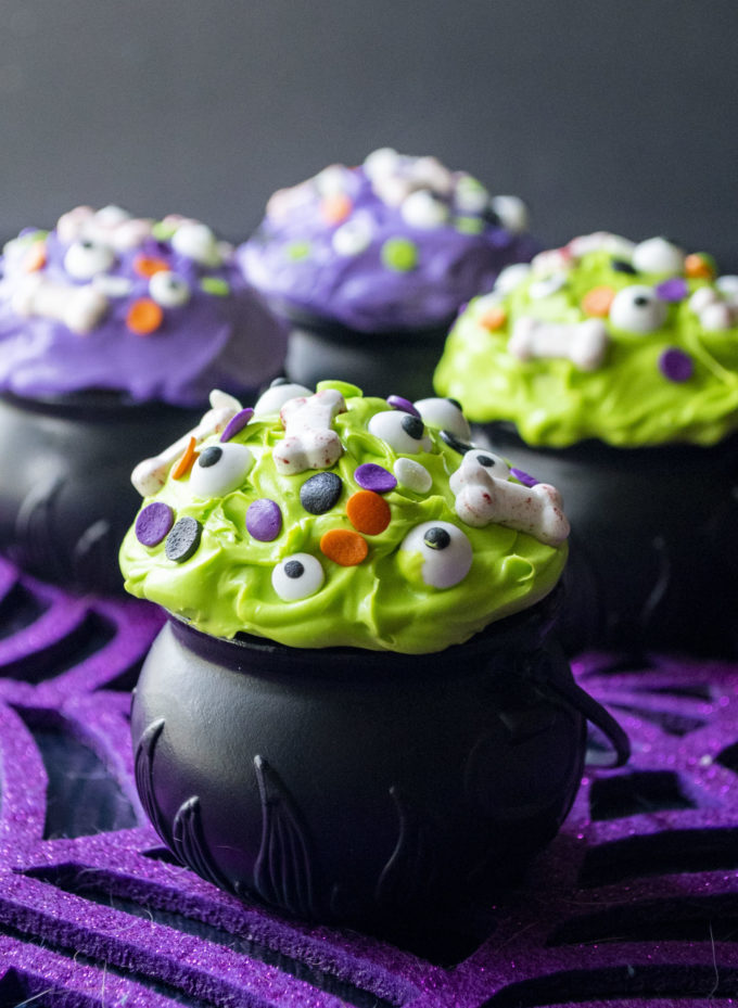 halloween witch cauldron cupcakes in purple and green frosting