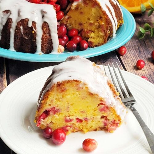 Moist and flavorful, this Cranberry Orange Bundt Cake combines tart cranberries, bright citrus zest, and rich buttery orange juice cake. Inspired by the Orange Juice Cake, this holiday bundt cake is the perfect addition to any holiday party or weekend brunch!  