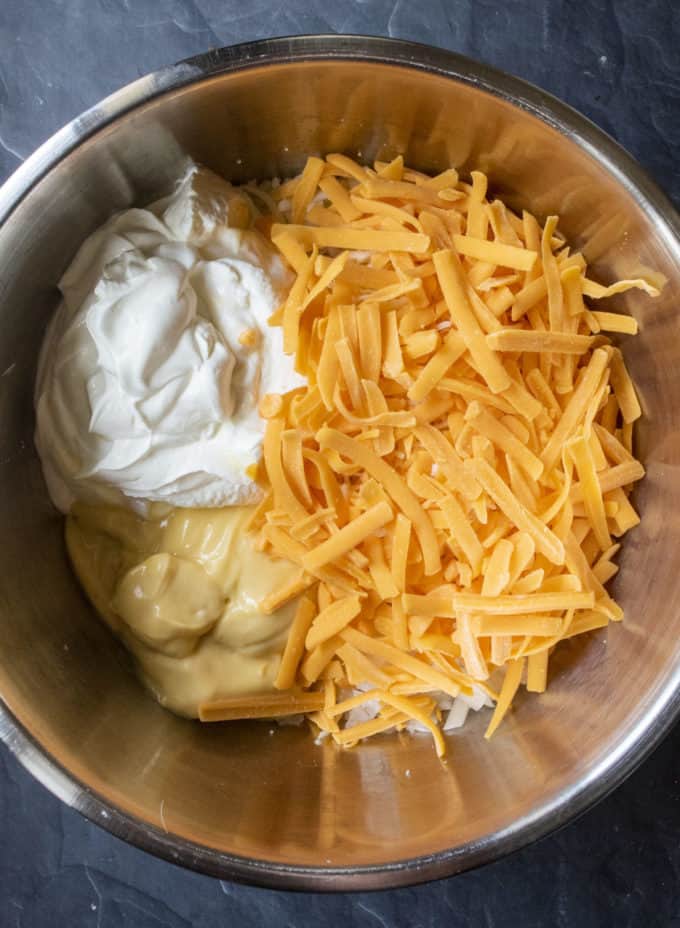 ingredients in a bowl for cheesy casserole