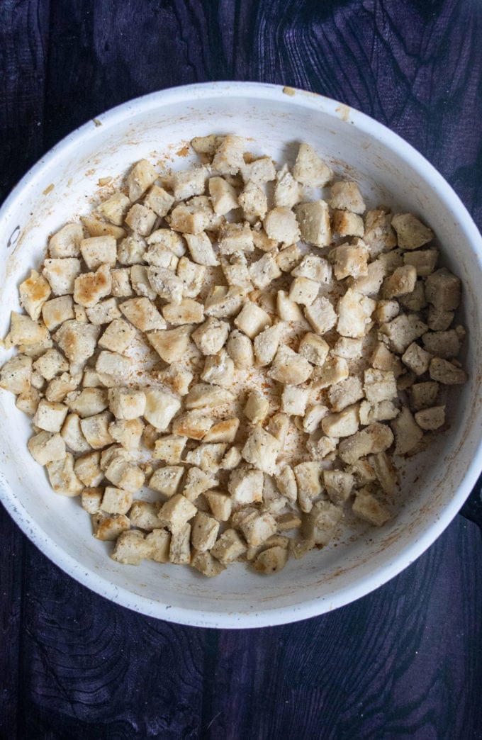 cooked pieces of chicken in a skillet