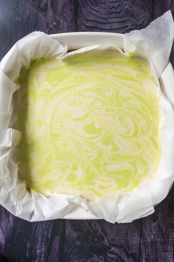 swirled cheesecake in a baking pan
