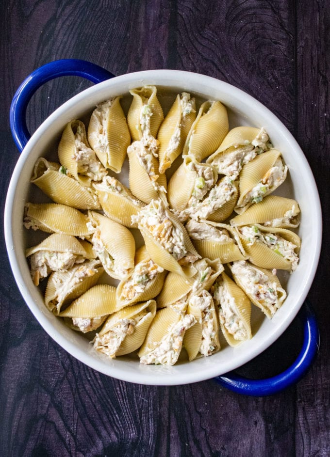 stuffed jalapeno shells in a baking dish