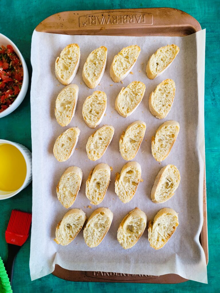 sheet pan of sliced baguette bread