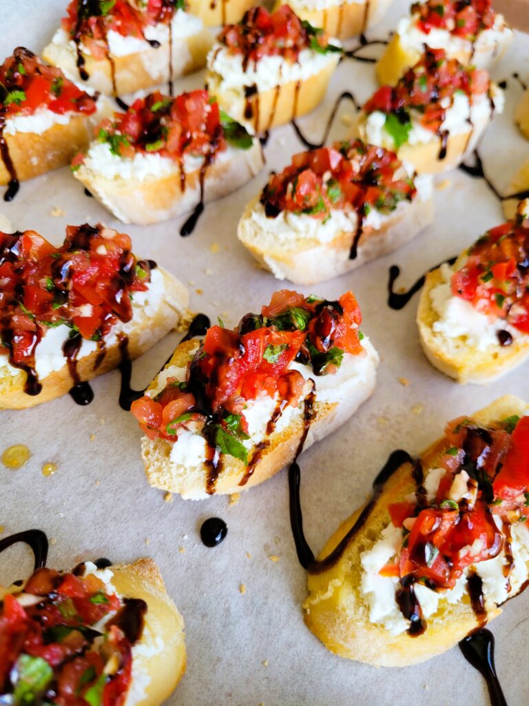 drizzling bruschetta with balsamic glaze