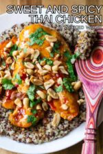 This Sweet and Spicy Thai Chicken pairs moist chicken breasts simmered in a spicy sweet chili sauce with creamy lime coconut quinoa and topped with crunchy peanuts. This easy to make Thai chicken dish is sure to be your new favorite 30 minute meal and is better than take-out!