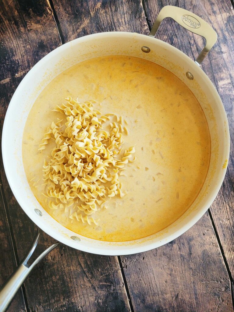 adding egg noodles to the chicken casserole