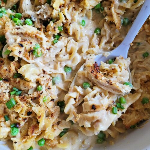Cheesy Chicken Noodle Casserole is the perfect classic combination of cheesy pasta, seasoned chicken and a Ritz cracker topping. Made from scratch, this old school chicken and egg noodle casserole is an easy weeknight dinner your family will love.