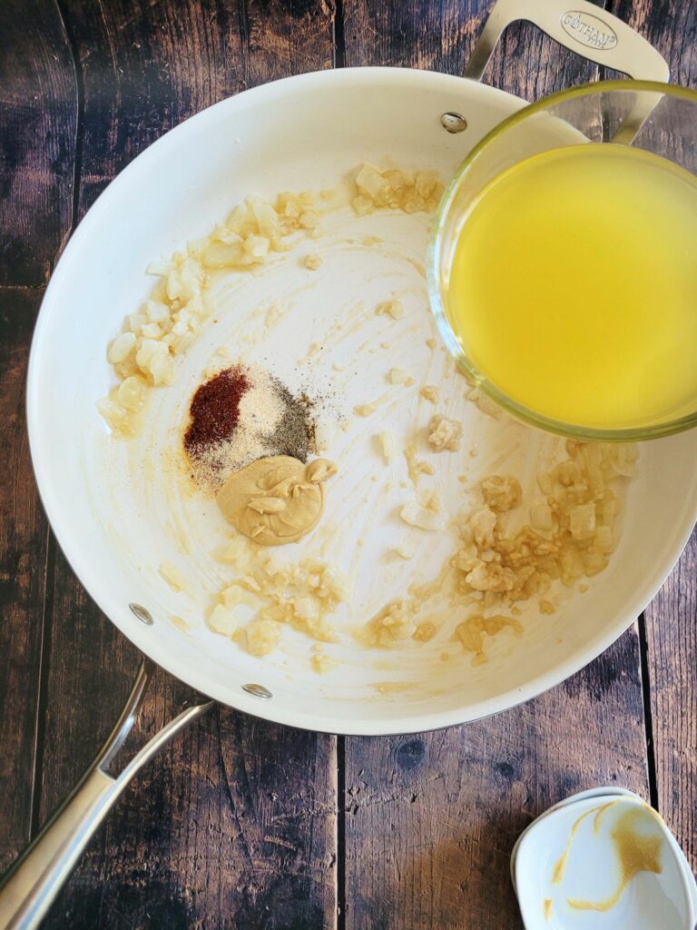 adding the chicken broth to a roux