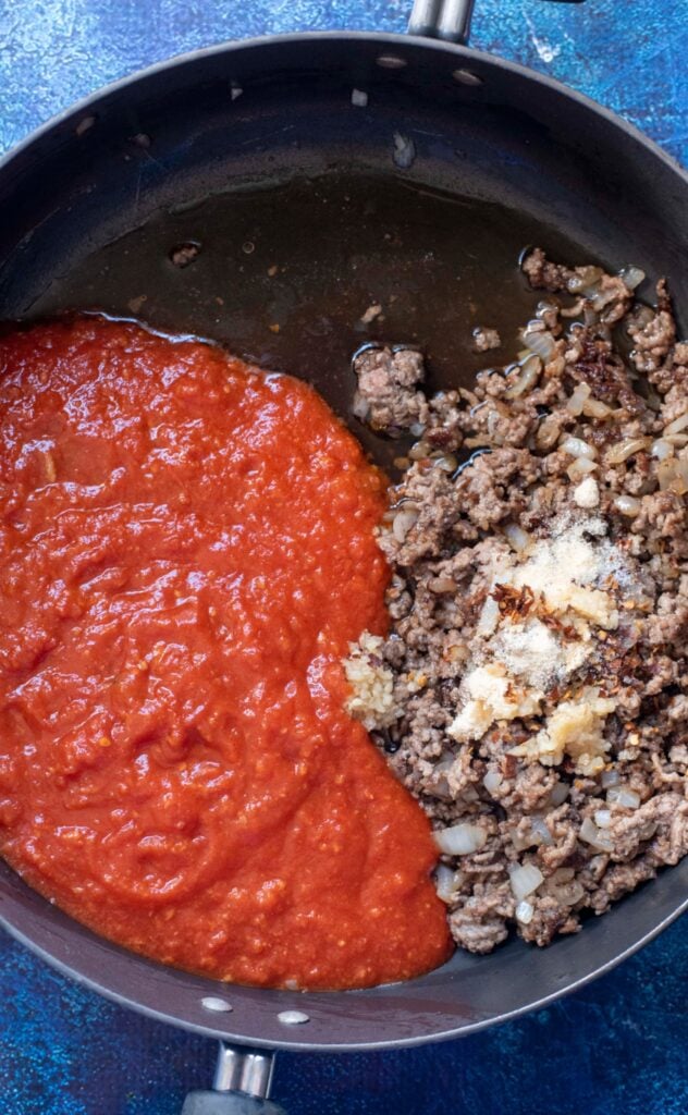 meat and spices in a pan