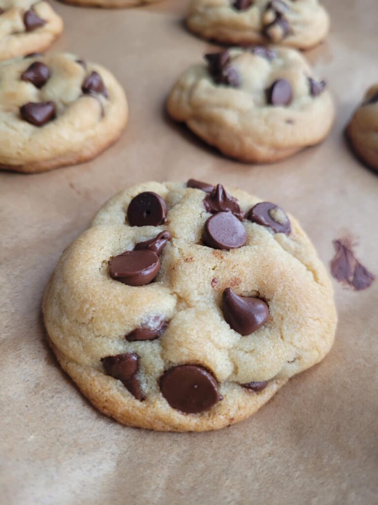 Freshly baked chocolate chunk cookies cooling on a wire rack