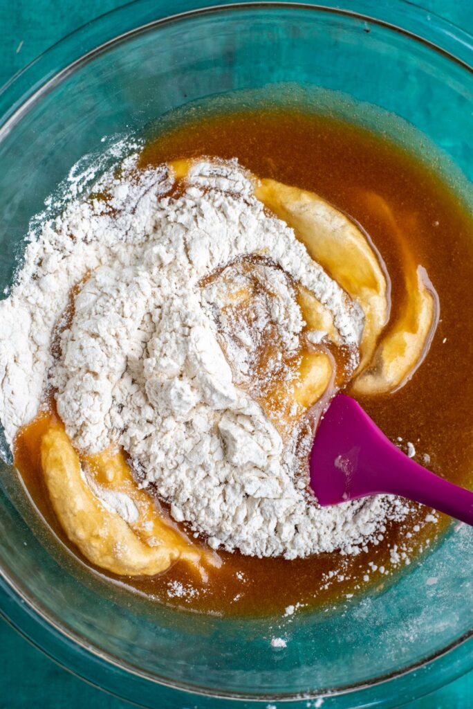 mixing wet and dry ingredients together for brown butter cookies